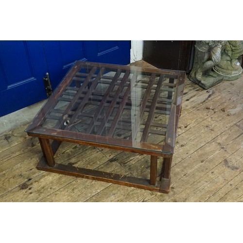 541 - A Hardwood Framed Lattice Work Top Glass Topped Coffee Table resting on Shaped Legs. Measuring: