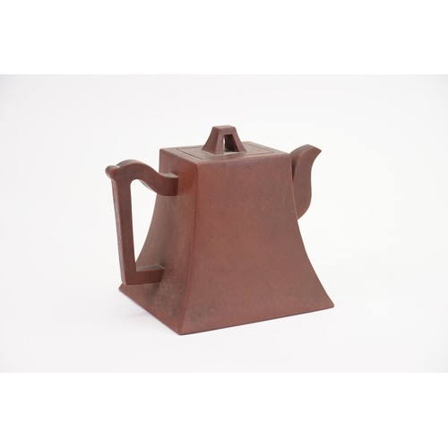 271 - A Yixing Tea Pot decorated with 16 Characters, Angular Handle, a Seal Mark & an A shaped lid.