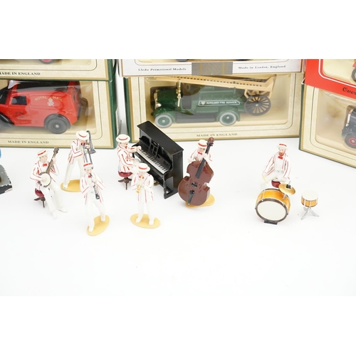 505 - A Musical Lead Band dressed in White & Red, Five Golly Figures & a Set of 6 Lledo Models.