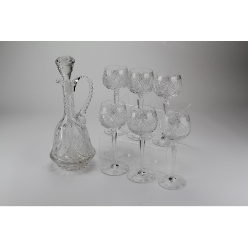 637 - A Cut Glass & Moulded Claret Decanter with a Set of 6 Matching wines with star cut bases.