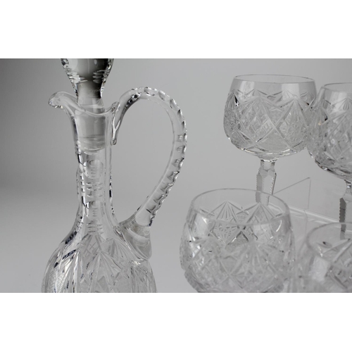 637 - A Cut Glass & Moulded Claret Decanter with a Set of 6 Matching wines with star cut bases.