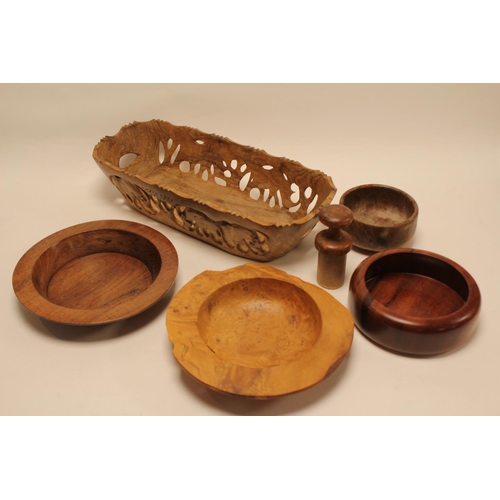 899 - An Indian carved wood bread basket, a John Davis bowl, chestnut bowl, etc.