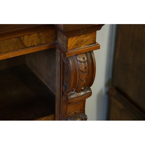 540 - A Victorian Walnut veneered Line inlaid Breakfront Bookcase fitted with shelves & a Carved Scrolled ... 