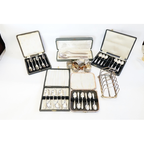 146 - Silver Plated Napkin Rings, Toast Rack, 5 various Silver Plated Cased Cutlery, etc.