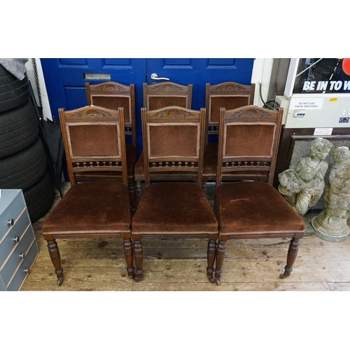 557 - A Set of 6 Edwardian Oak Framed Dining Chairs with carved Cresting Rail & Turned Front Legs.