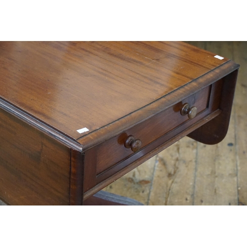 566 - A Late 19th Century Mahogany Drop-Flap Table resting on splayed out & ribbed legs, Castors & a Singl... 