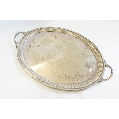 152 - A Large Oval Victorian Silver Plated Tea Tray with gadrooned handles. Measuring: 65cms x 41cms.