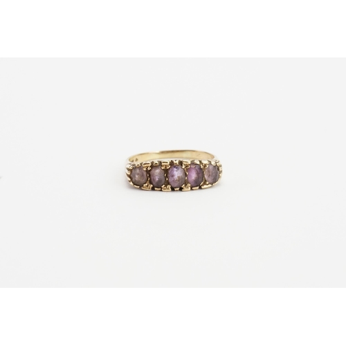 158 - A 9ct Gold Amethyst set ring, set with five Amethysts. Size U. Weight 3.7g.