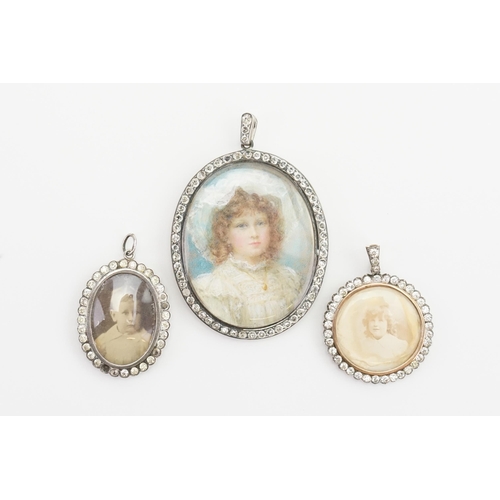 154 - A collection of three portrait pendants, set with paste stones surrounds.