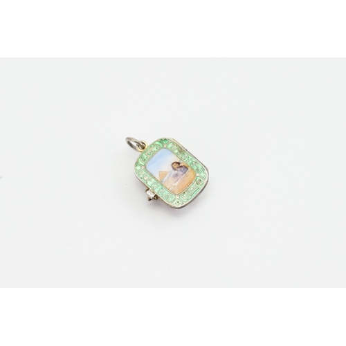 190 - An interesting 800 marked green enamelled pendant, decorated with a Sphinx and Pyramid.  Weight 3.7g... 