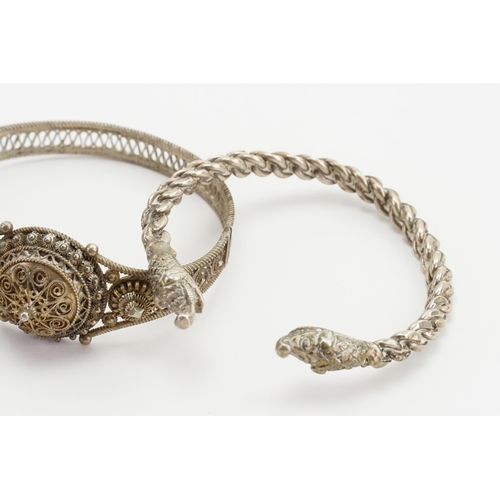 274 - A collection of various Silver coloured white metal bangles, to include the filigree design marked 8... 