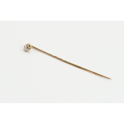 211 - An unmarked Diamond set tie pin. Set with one diamond approx. 0.22ct. Weight 1.1g.