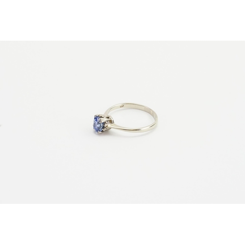 192 - A 18ct white Gold Sapphire set ring, Sapphire size approx 0.15ct. Weight 2g. Size k/L