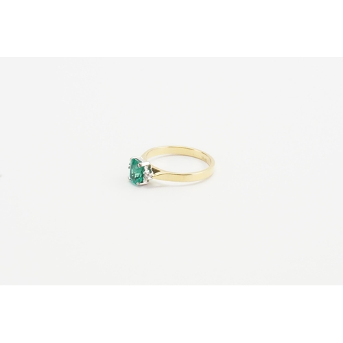 198 - A 18ct Gold Emerald and Diamond set ring, set with a single 0.5ct Emerald and two chip diamonds. Wei... 