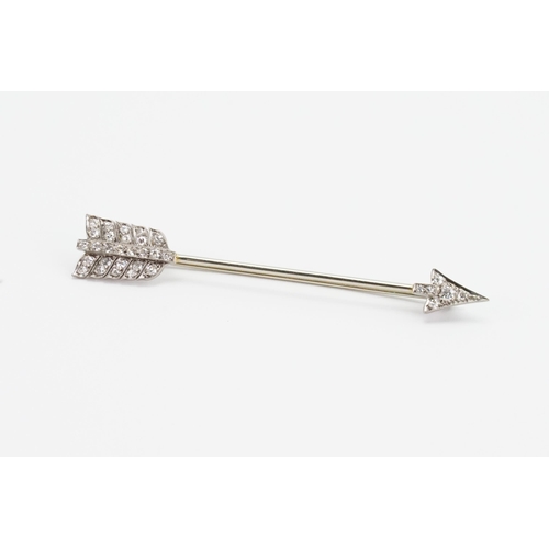 201 - A white gold diamond set arrow brooch (tests as 18ct white gold, as per insurance valuation). The br... 