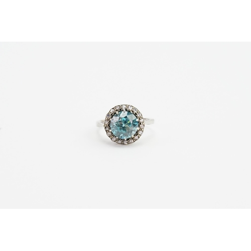 202 - A 9ct white gold cluster style ring, set with a brilliant cut natural bright blue zircon (approx 2.2... 