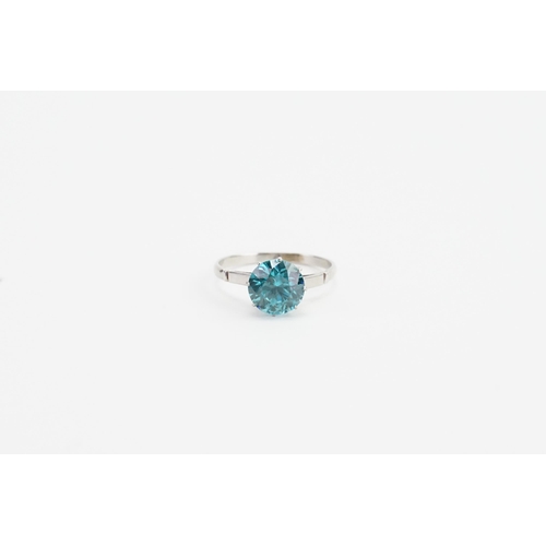 204 - A 18ct white gold ring, set with a brilliant cut intense blue natural zircon. Approx 2ct. Size M. We... 