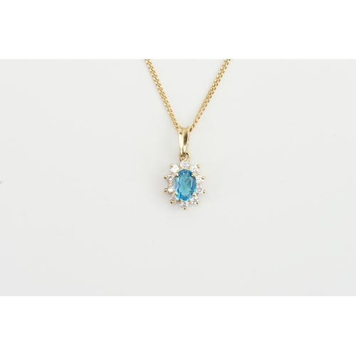 206 - A 9ct gold pendant set with paste and a topaz. Hung on unmarked chain.