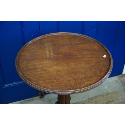 526 - A Victorian Circular Topped Mahogany Wine Table resting on Tripod Legs. Measuring: 54cms across x 72... 