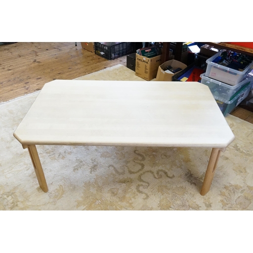 525 - A Bleached Beech Sectional Coffee Table resting on openwork legs made by 