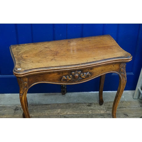 504 - A Victorian Mahogany Bow Fronted Fold Over Top Card Table with Walnut resting on elongated shaped fe... 