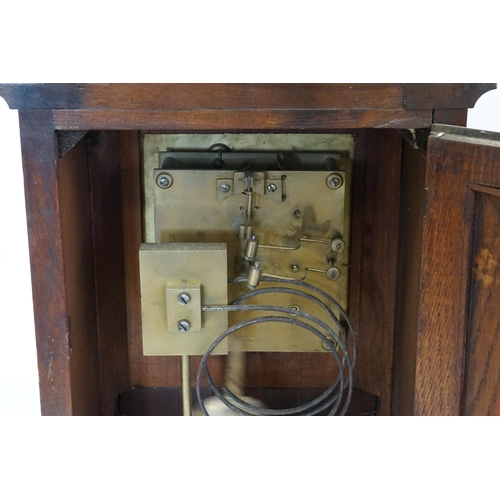 338 - A Victorian Oak Cased Bracket Clock with a Nickle Silver Dial, Cast Brass Spandrels, Fluted Columns ... 