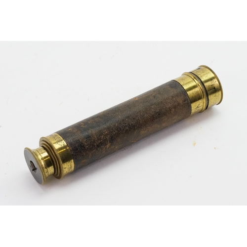 595 - An Extendable Brass Telescope with a Leather Covering & a Rotating Eye Piece.