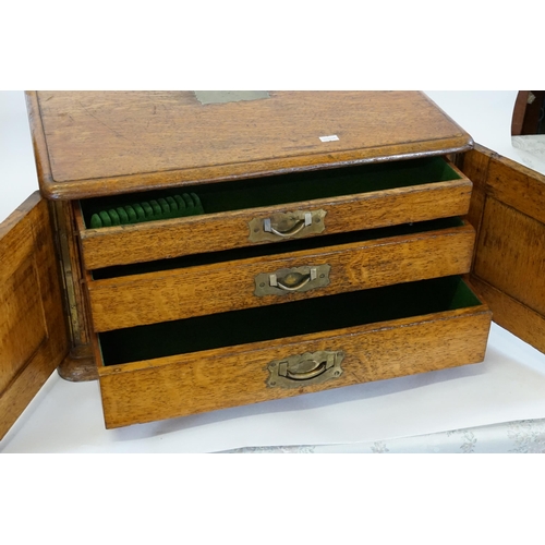 599 - An Oak & Brass Handled & inlaid Collectors Cabinet. Measuring: 50cms across x 38cms deep x 26cms hig... 