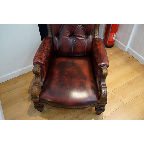 499 - A Victorian Leather Seated & Oak Framed Button Back Library Chair resting on Shaped Back Legs & Carv... 