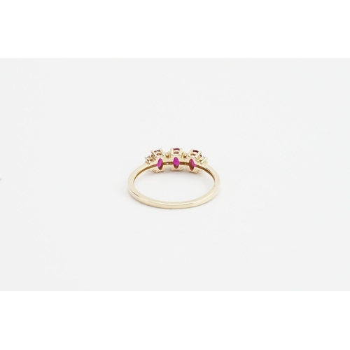 233 - A 9ct yellow gold ruby and diamond set ring, set with 3 oval cut ruby stones and eight chip diamonds... 