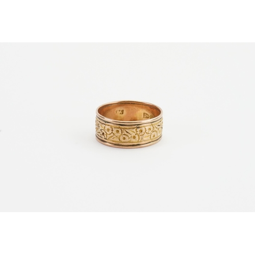 220 - A 9ct gold Chester marked wedding band, with floral decoration. Weight 5.3g. Size U.