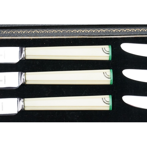 131 - A cased set of art deco cream & green handled cutlery.