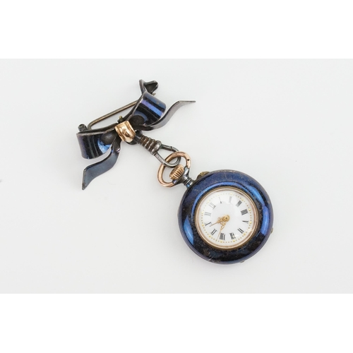 305 - A blue & gold coloured ladies pocket watch. With bow brooch attachment.