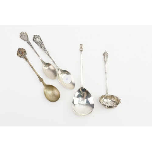 99 - A silver sifter spoon, and a ER commemorative silver spoon, along with others.