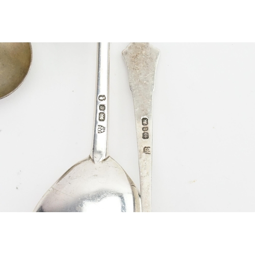 99 - A silver sifter spoon, and a ER commemorative silver spoon, along with others.