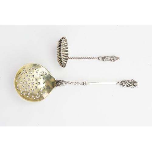 61 - A 1844 silver sifter spoon, along with a apostle silver spoon. Weight 40g.