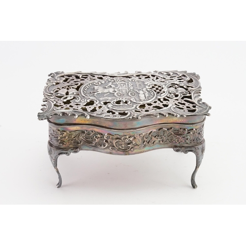 64 - A 1905 William Comyns & Sons silver pierced casket. Depicting a horse and carriage scene. 14.5cm x 1... 