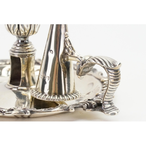 66 - A 1820 Thomas Ross silver candle holder and snuffer, in the shape of a flower. Snuffer is marked TJ.... 