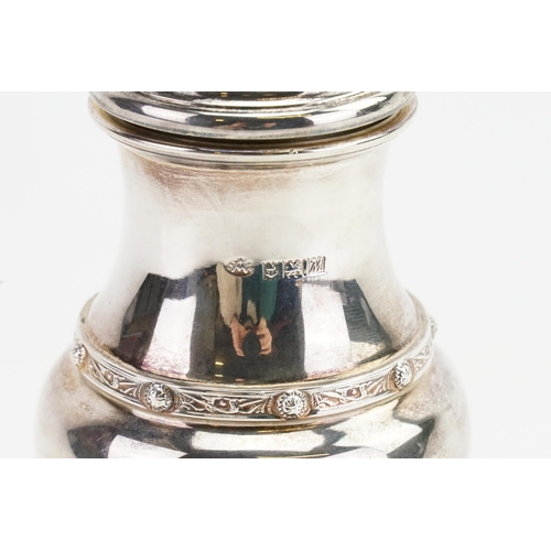 67 - A 1961 Adie Brothers Ltd silver sugar shaker, with decorated edge. Weight 161g.