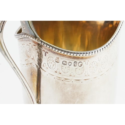 72 - A 1871 Victorian silver Andrew Crespel & Thomas Parker milk jug. Bead and ribbon decoration. Weight ... 