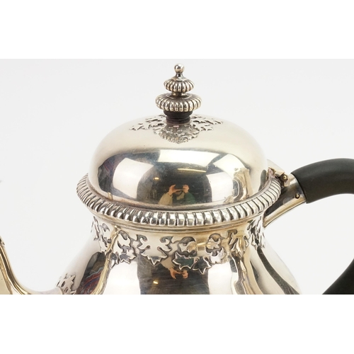 81 - A 1919 Wakely & Wheeler silver tea & coffee service, to include sugar and cream. Decorated with bead... 