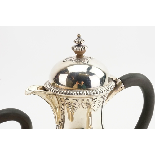 81 - A 1919 Wakely & Wheeler silver tea & coffee service, to include sugar and cream. Decorated with bead... 