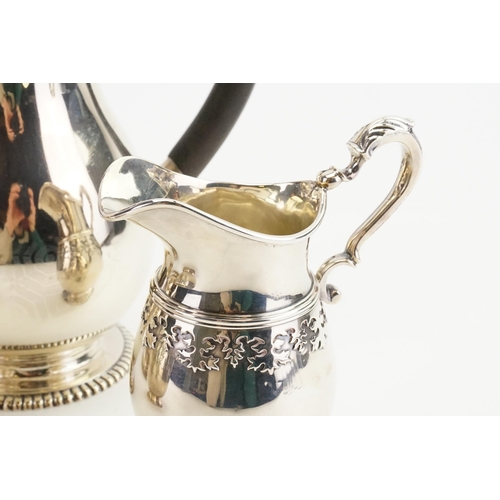 81 - A 1919 Wakely & Wheeler silver tea & coffee service, to include sugar and cream. Decorated with bead... 