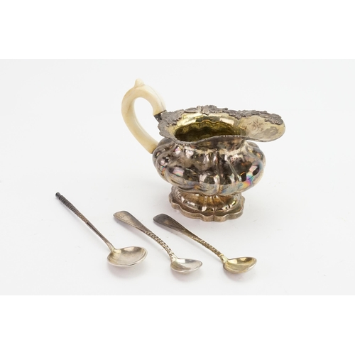 91 - A silver 84 marked cream jug, marked 1843. Decorated with grape design, along with three similar mar... 