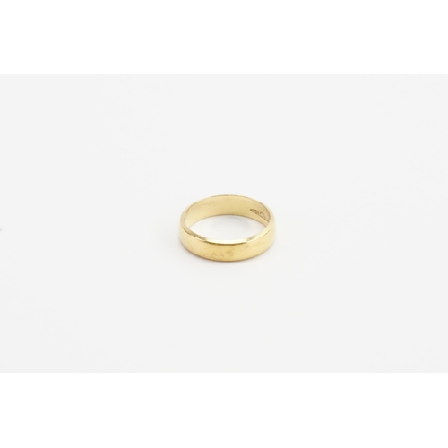 219 - A 22ct yellow gold band. Size M. Weight 4.9g.