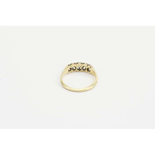 239 - A 18ct gold Victorian style wedding ring. Set with five diamonds. Largest approx 0.17ct. Weight 3.1g... 