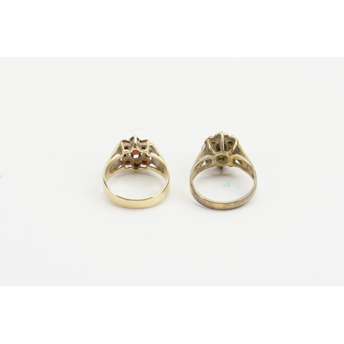 240 - Two 9ct gold rings, one set with a sapphire and the other garnets. Weight 7.6g.