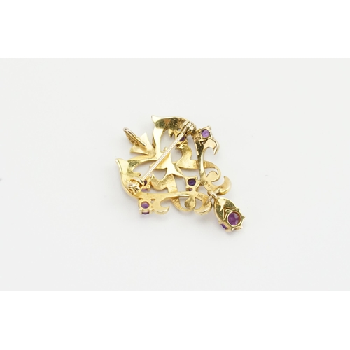 242 - A 9ct yellow gold Amethyst and pearl set brooch, with pendant attachment. Weight 6.8g.