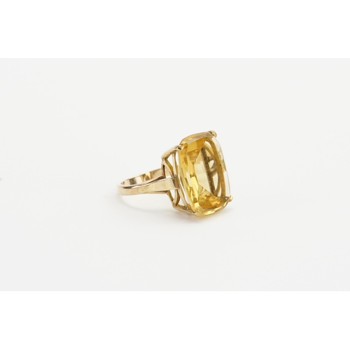 243 - A 9ct gold large Citrine set ring. Citrine size apprx 15.2mm x 19.8mm. Weight 6.7g. Size P.