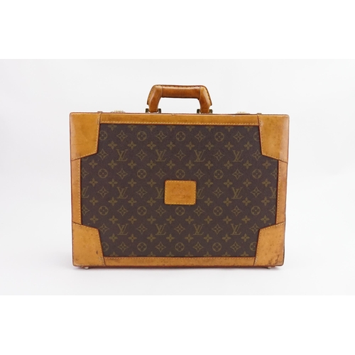 601 - A Louis Vuitton style brief case. Given to the vendor in the 1990s.